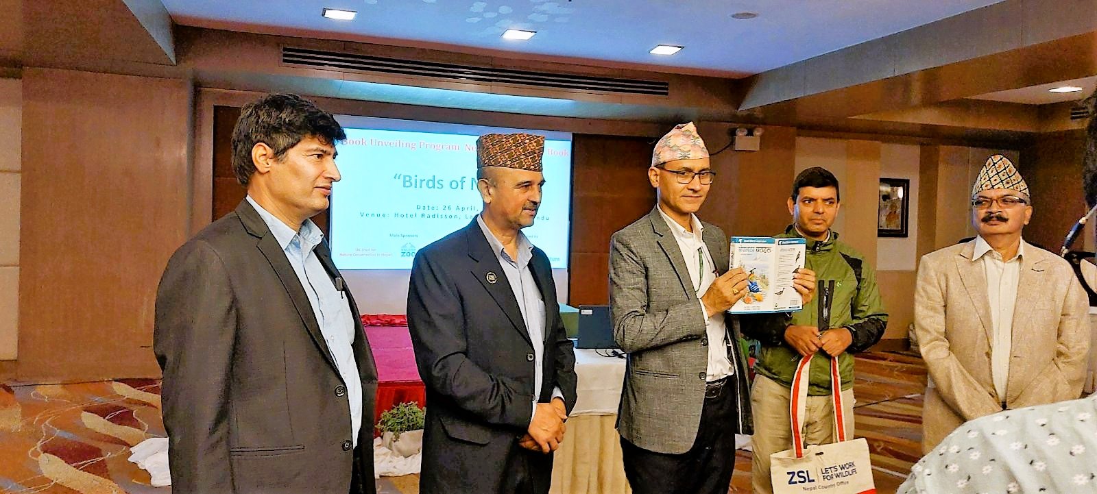 Chief Guest Dr. Ram Chandra Kandel; Director General of Department of National Parks and Wildlife Conservation (DNPWC) unveiling the "Birds of Nepal; a field guide to the birds of Nepal"